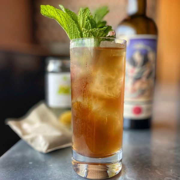 A highball garnished with mint