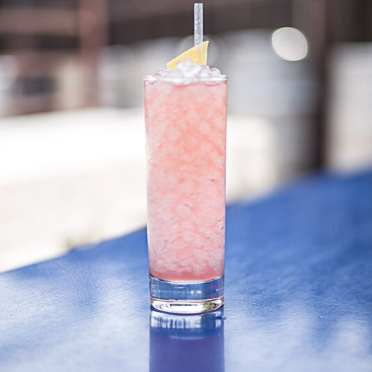 Pink drink over crushed ice